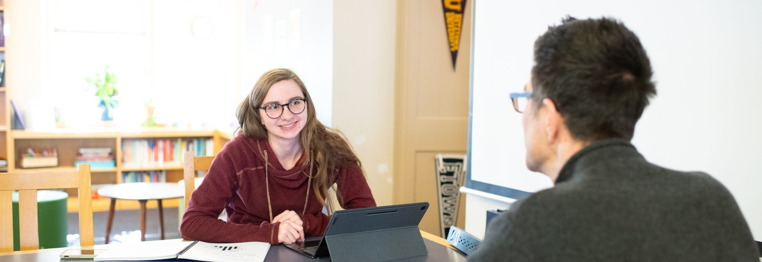 student being mentored by teacher