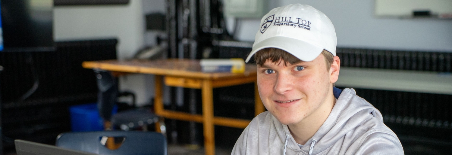 Student sporting hill top hat
